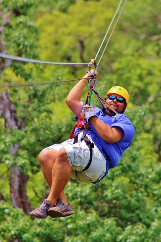 "Ziplining adventure in Tamarindo Beach, Costa Rica, soaring above lush tropical forests with stunning ocean and jungle views." 🌿🌊✨
