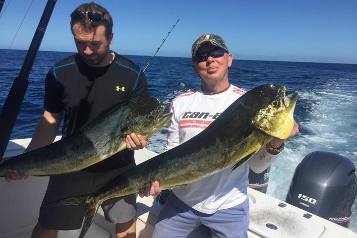 "Fishing boat on Flamingo Beach, Costa Rica, with anglers casting their lines into the calm ocean waters, surrounded by tropical scenery." 🎣🌊🌴
